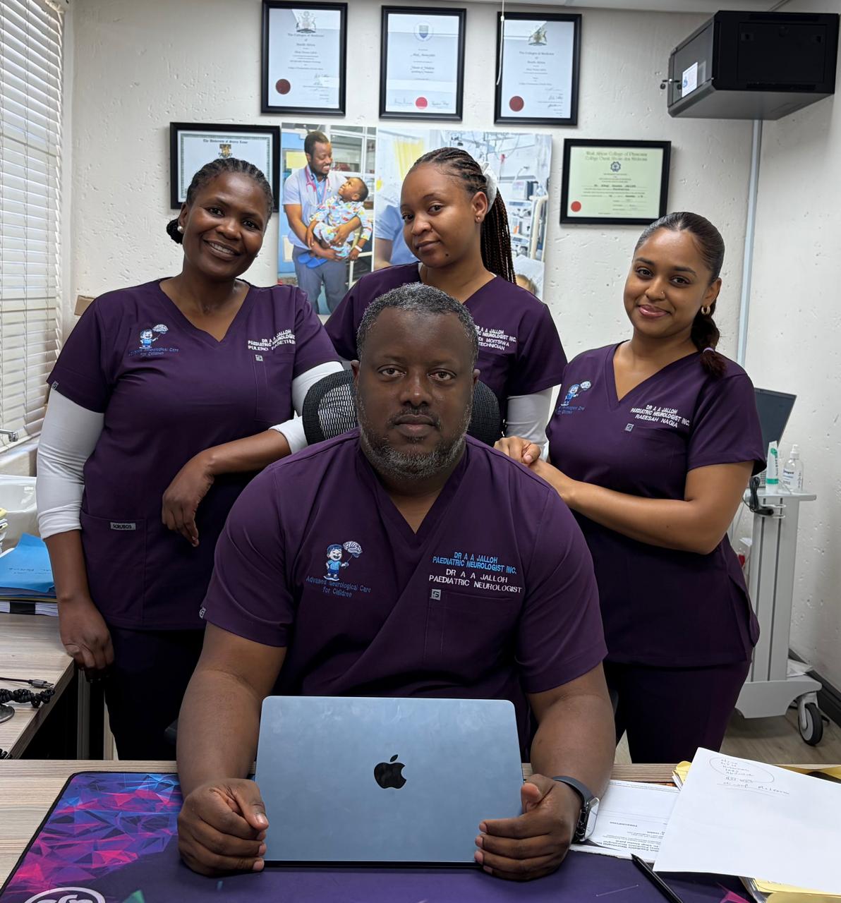 Dr A A Jalloh with the practice team